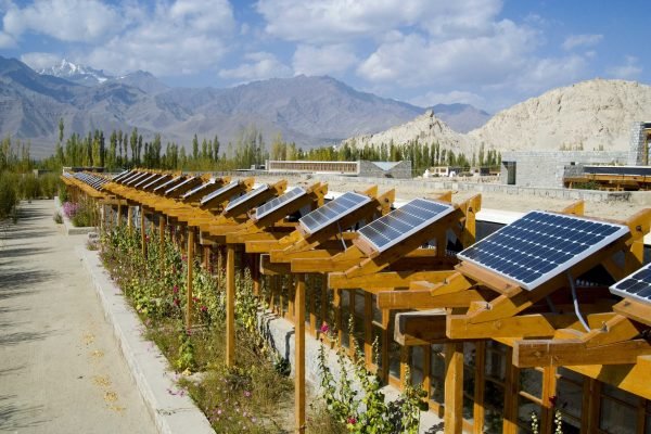 array of photo-voltaic solar panels on school roof (advanced solar energy system making school energy self-sufficient), peaks of zanskar range in bckgnd.
druk white lotus school (padma/pema karpo educational institute, world architecture award: best green building 2002), shey, ladakh, jammu&kashmir, himalayas, india